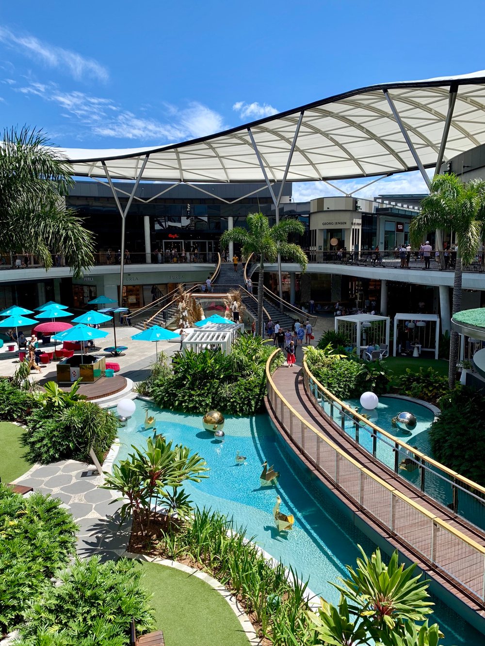Water features and a curving boardwalk in Pacific Fair's open-air precinct