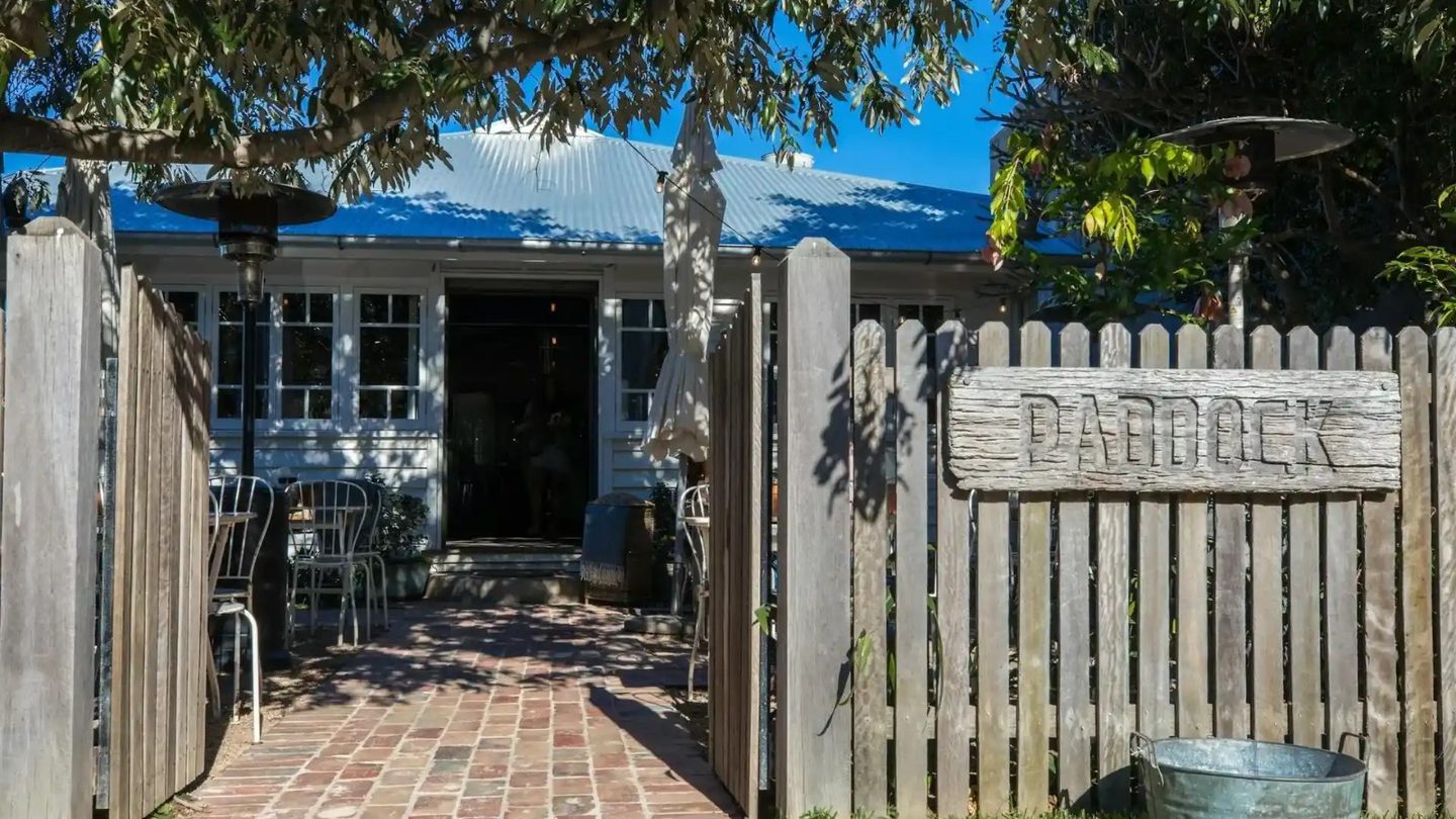 The timber gate and brick courtyard at Paddock Bakery