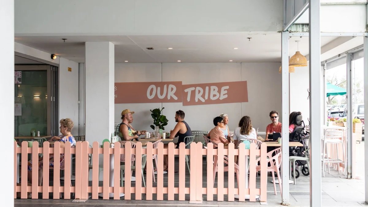 The Our Tribe sign and picket fence out front, Kirra