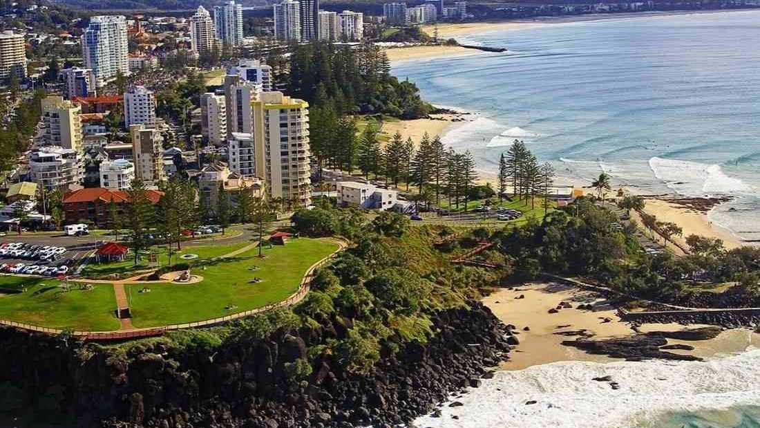 Point Danger headland and the beaches running north to Kirra, from the air