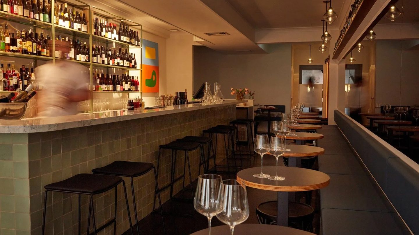The long bar and stools at Paloma Wine Bar