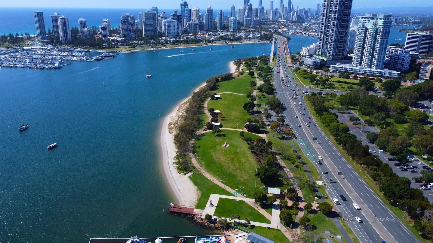 Broadwater Parklands along the water, with the Southport skyline, from the air