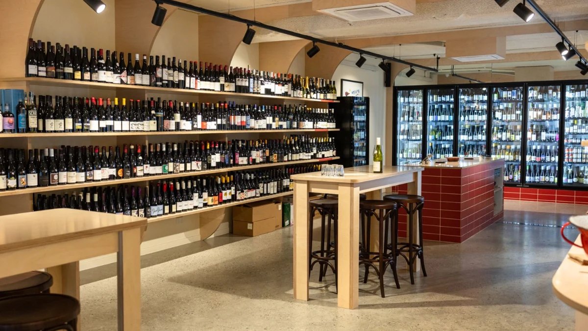Wine shelves and fridges at Flor Wine & Grocer