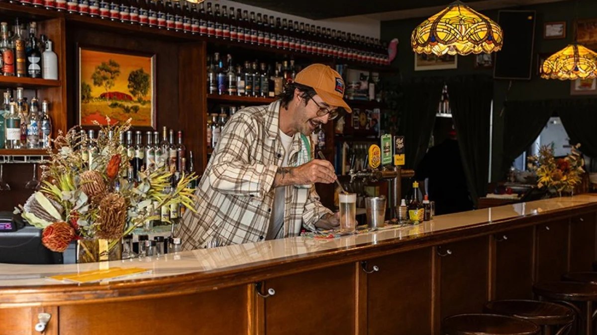 A bartender at the timber bar at Rosella's
