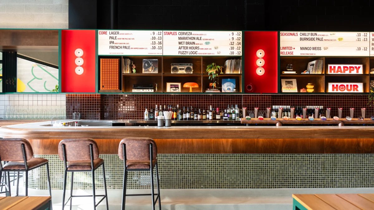 The bar and red beer-list boards at Padre Brewing Co.