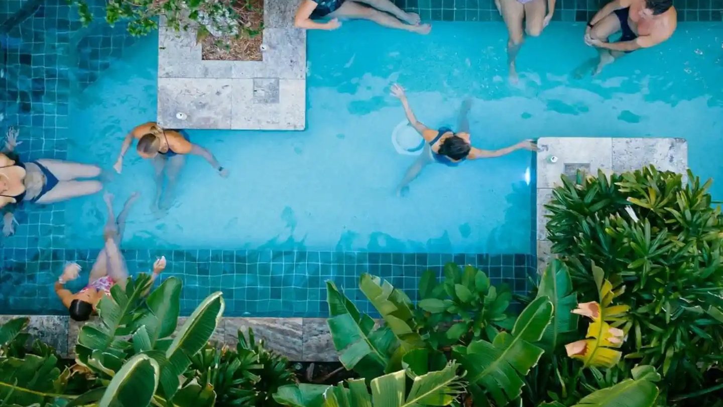 Bathers in the plunge pool at Soak Bathhouse, seen from above