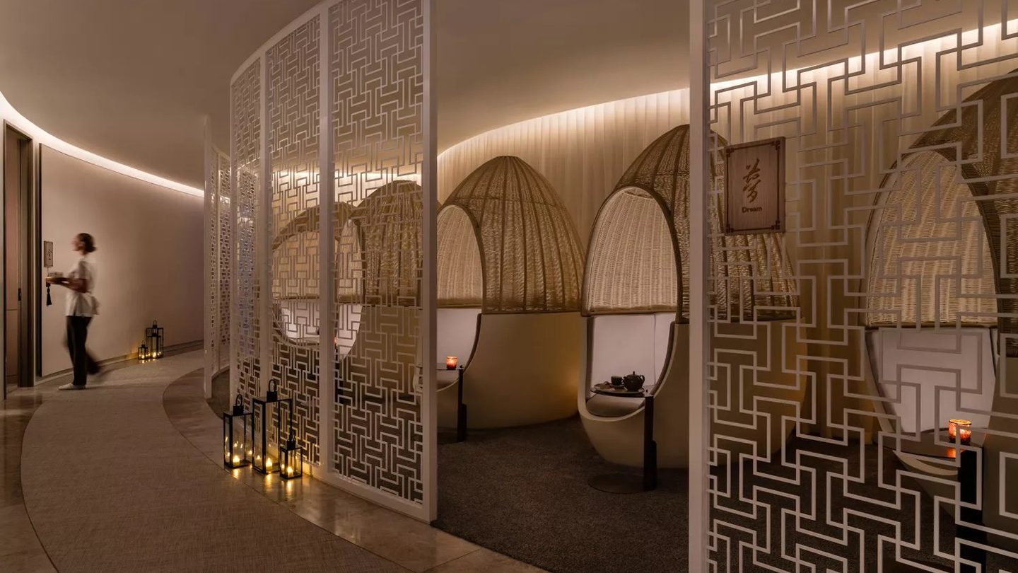 Lattice screens and lantern-lit lounge chairs at Chuan Spa