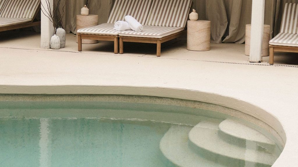 Sun loungers beside the pool at Greenhouse The Bathhouse