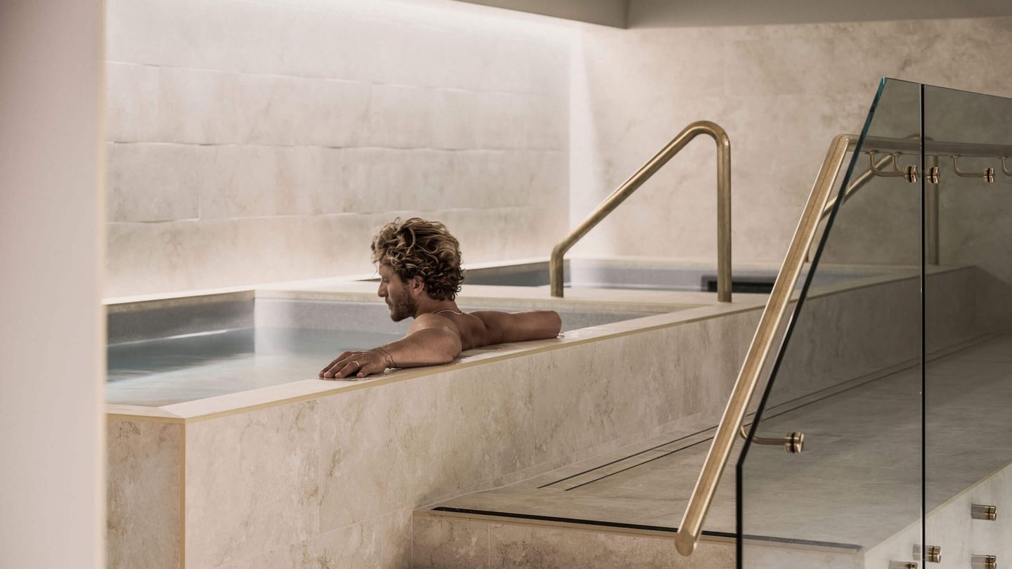 A bather in the stone plunge pool at Native State