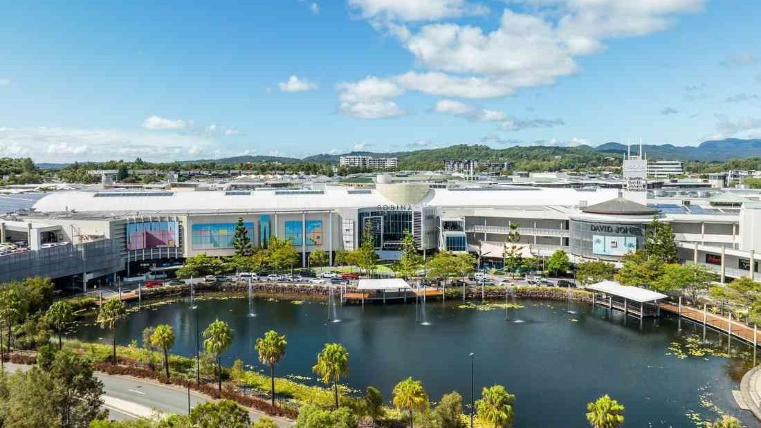 Robina Town Centre beside its lake, seen from above
