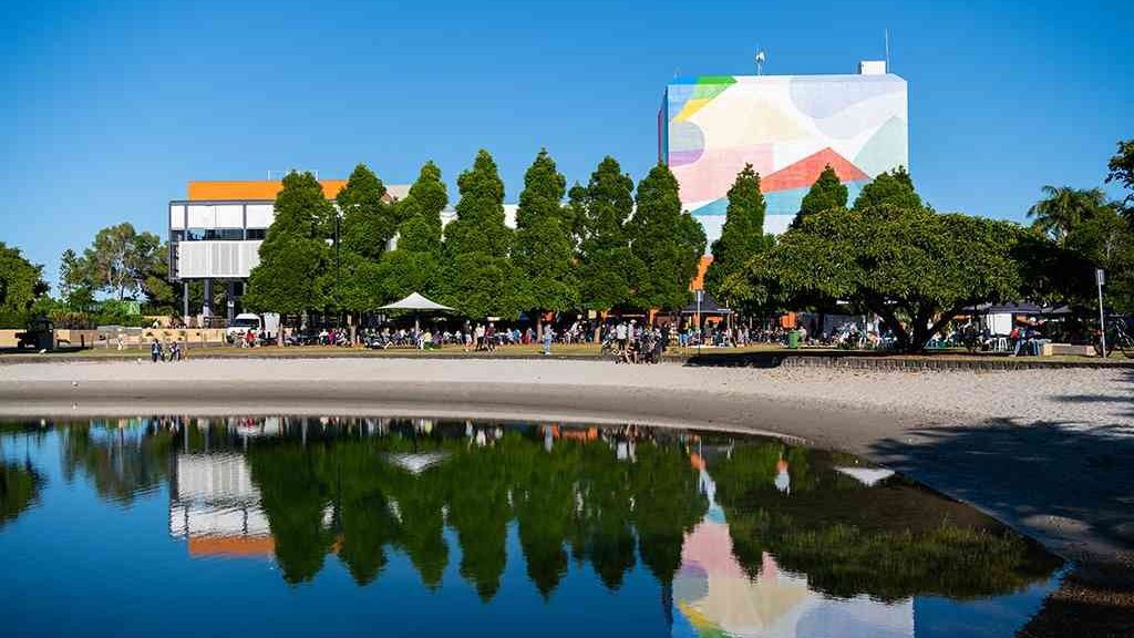 HOTA's lake and gallery, with the Sunday market stalls under the trees