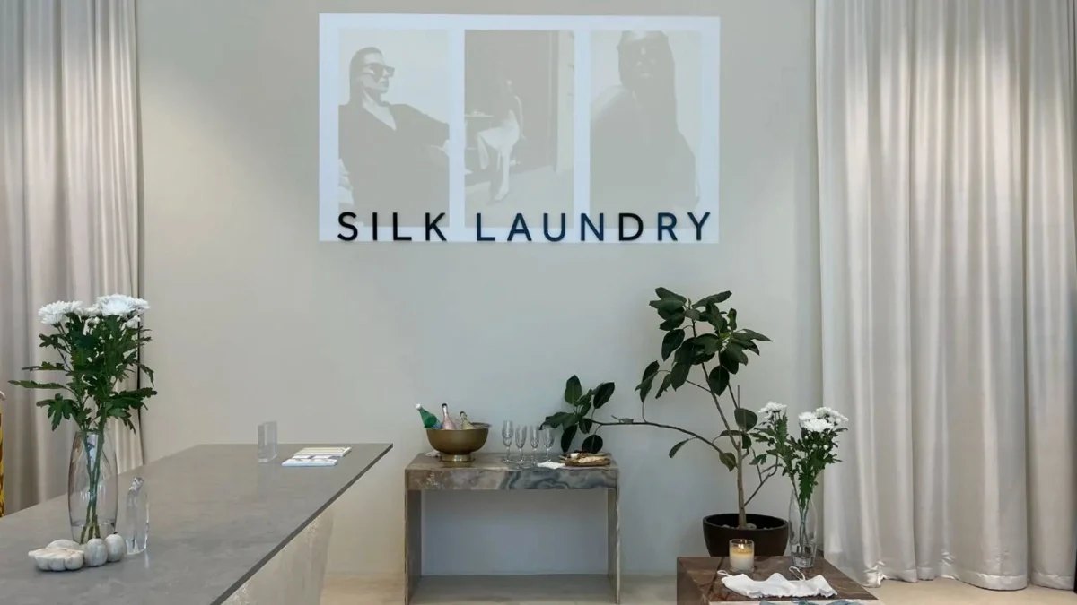 The Silk Laundry store, with a marble counter and white flowers