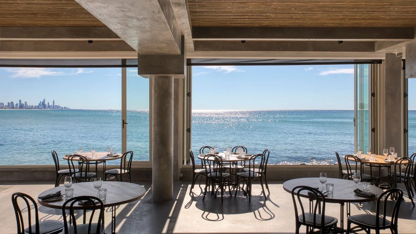 The Rick Shores dining room, open to the ocean, with the Surfers Paradise skyline in the distance
