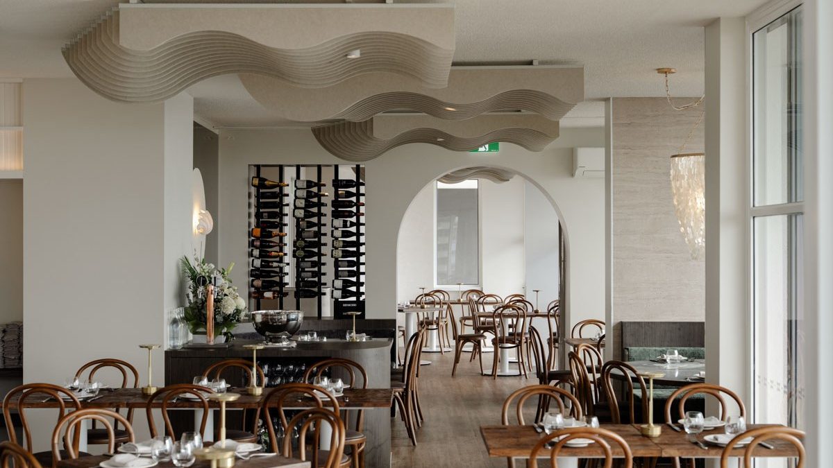 The Cooly Breeze dining room, with arched doorways and a wall of wine