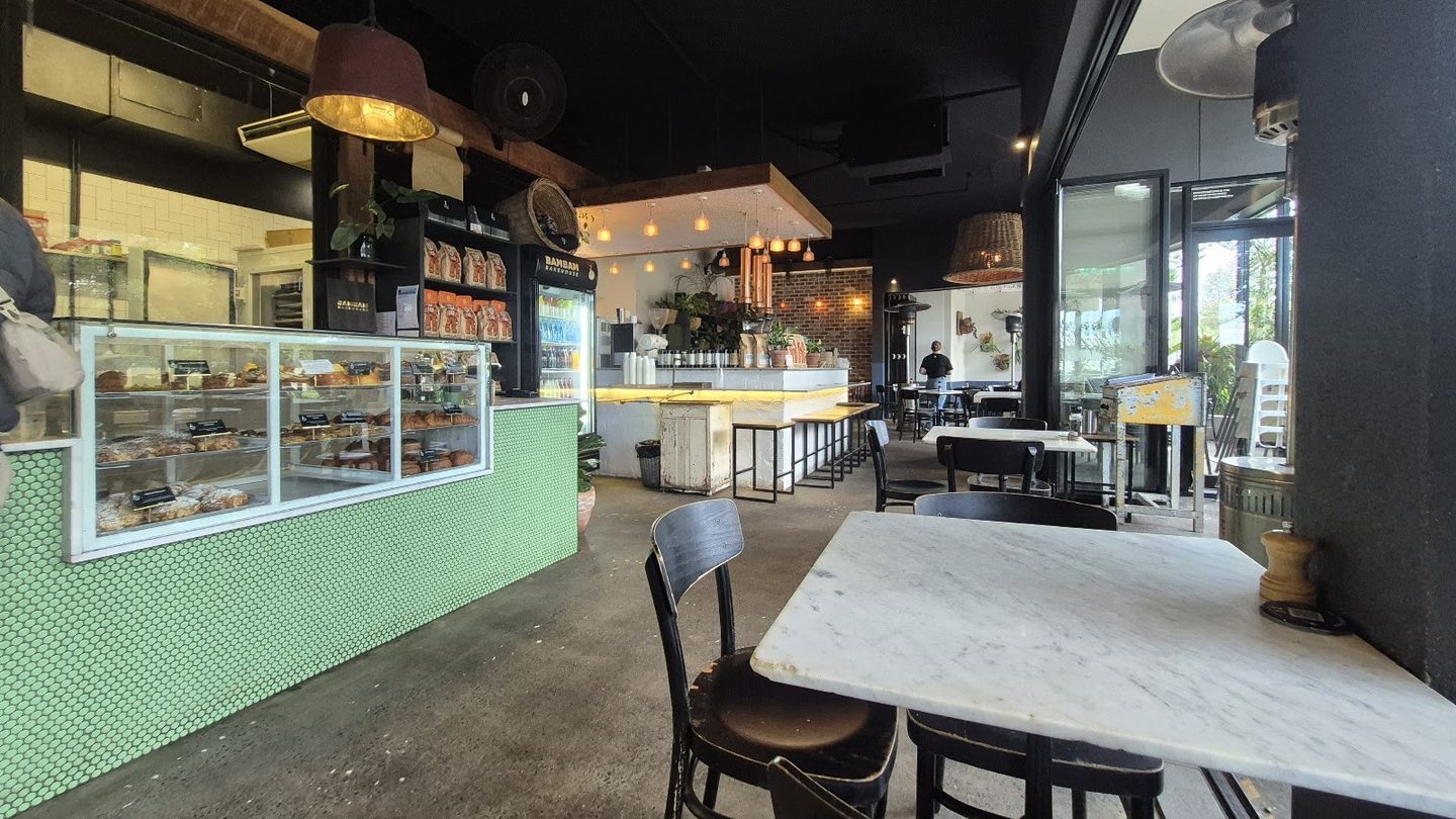 The pastry counter and green-tiled bar at Bam Bam Bakehouse