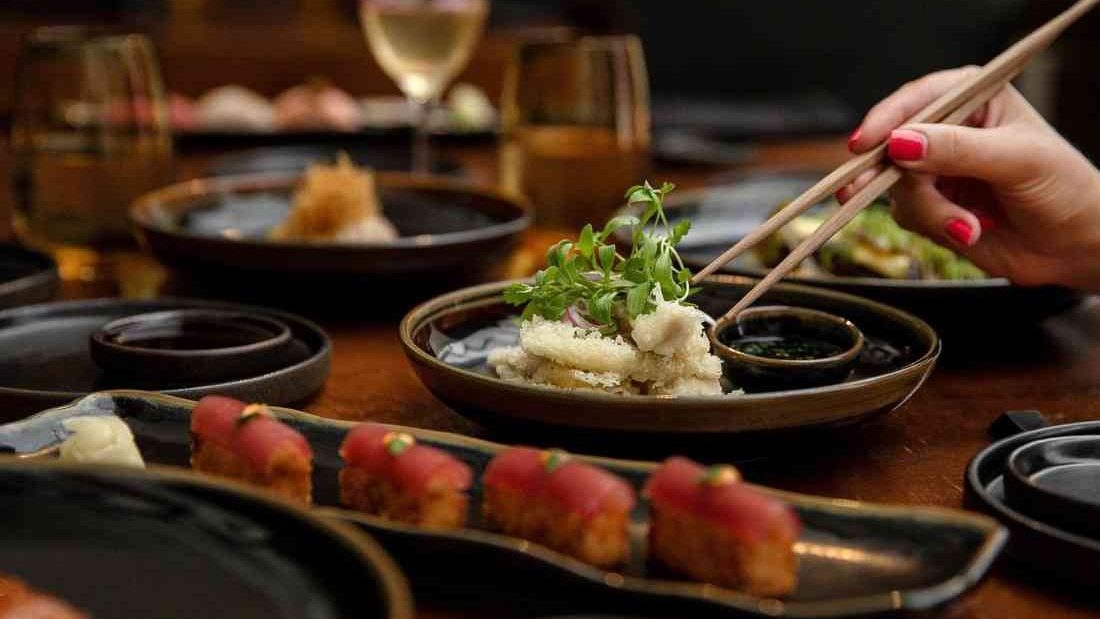 Japanese dishes and tuna nigiri being served at Kiyomi