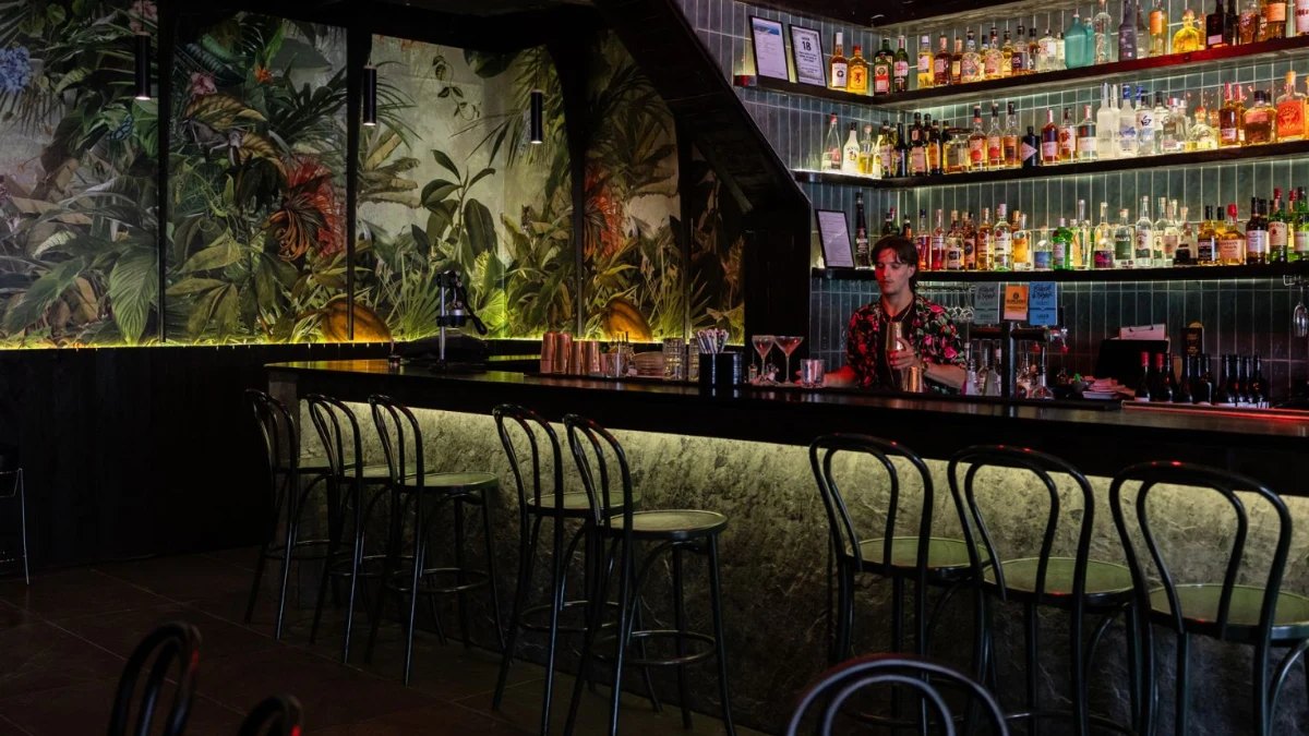 The dark, jungle-papered bar at Pokkoi