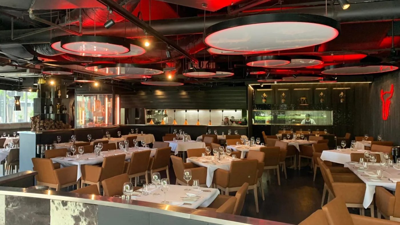 Moo Moo's dining room under red oval ceiling lights