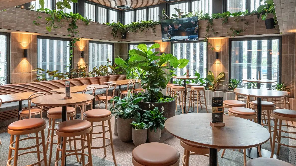 The plant-filled Garden Room at Mermaid Beach Tavern