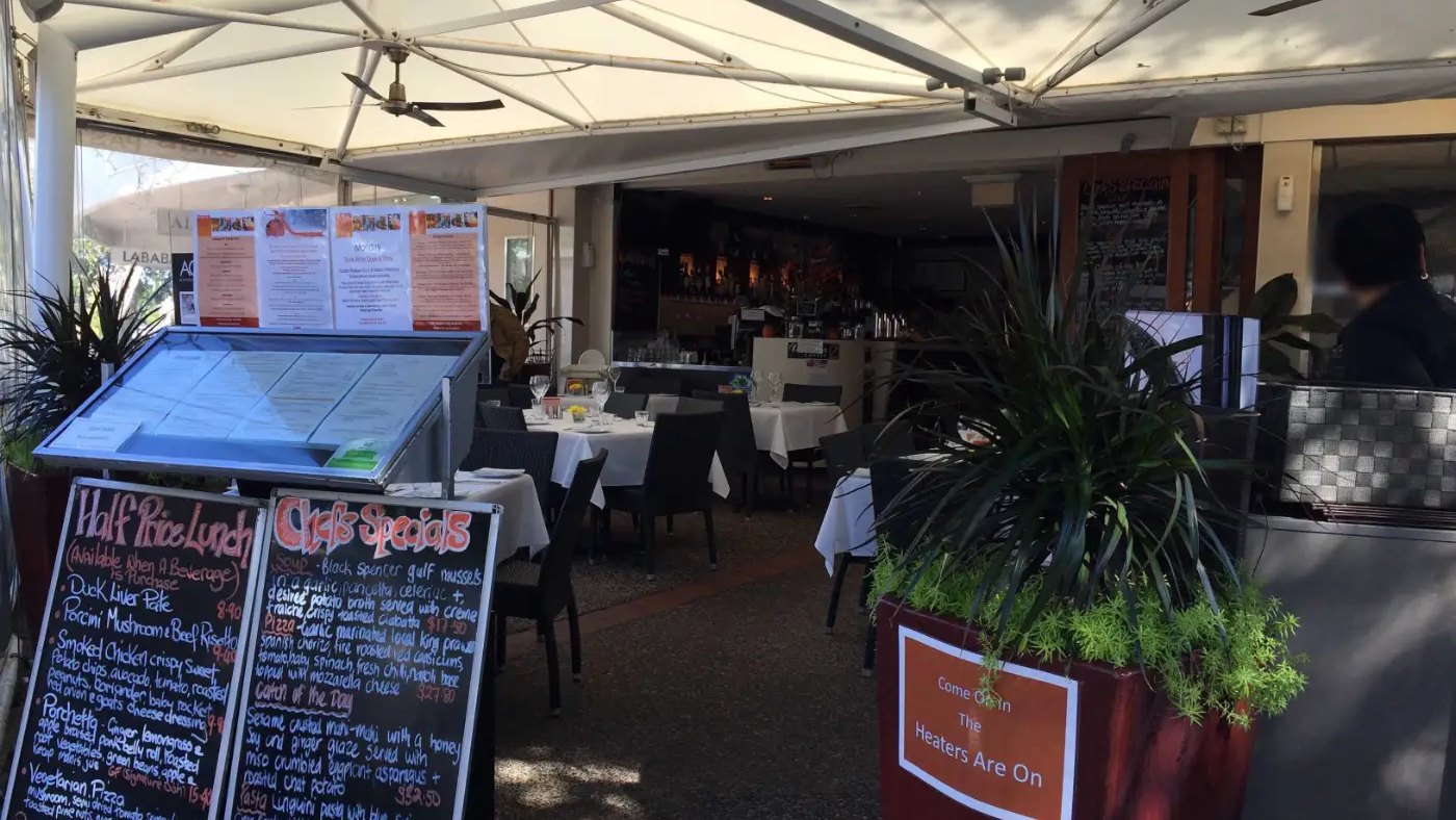 Menu boards and the covered terrace at Domanis