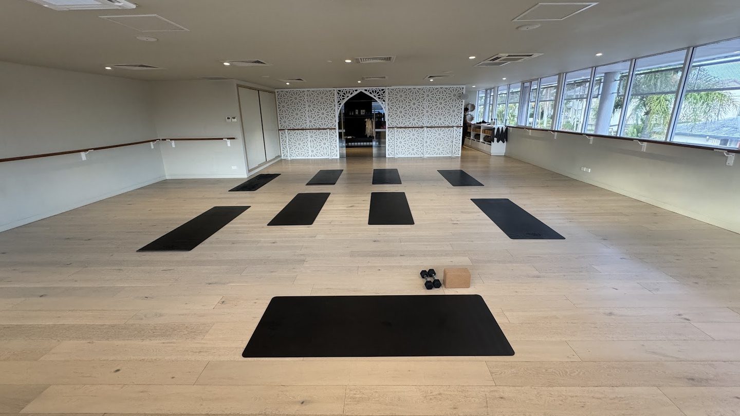 Mats laid out in the bright, empty studio at Flolo Studio Mermaid Beach