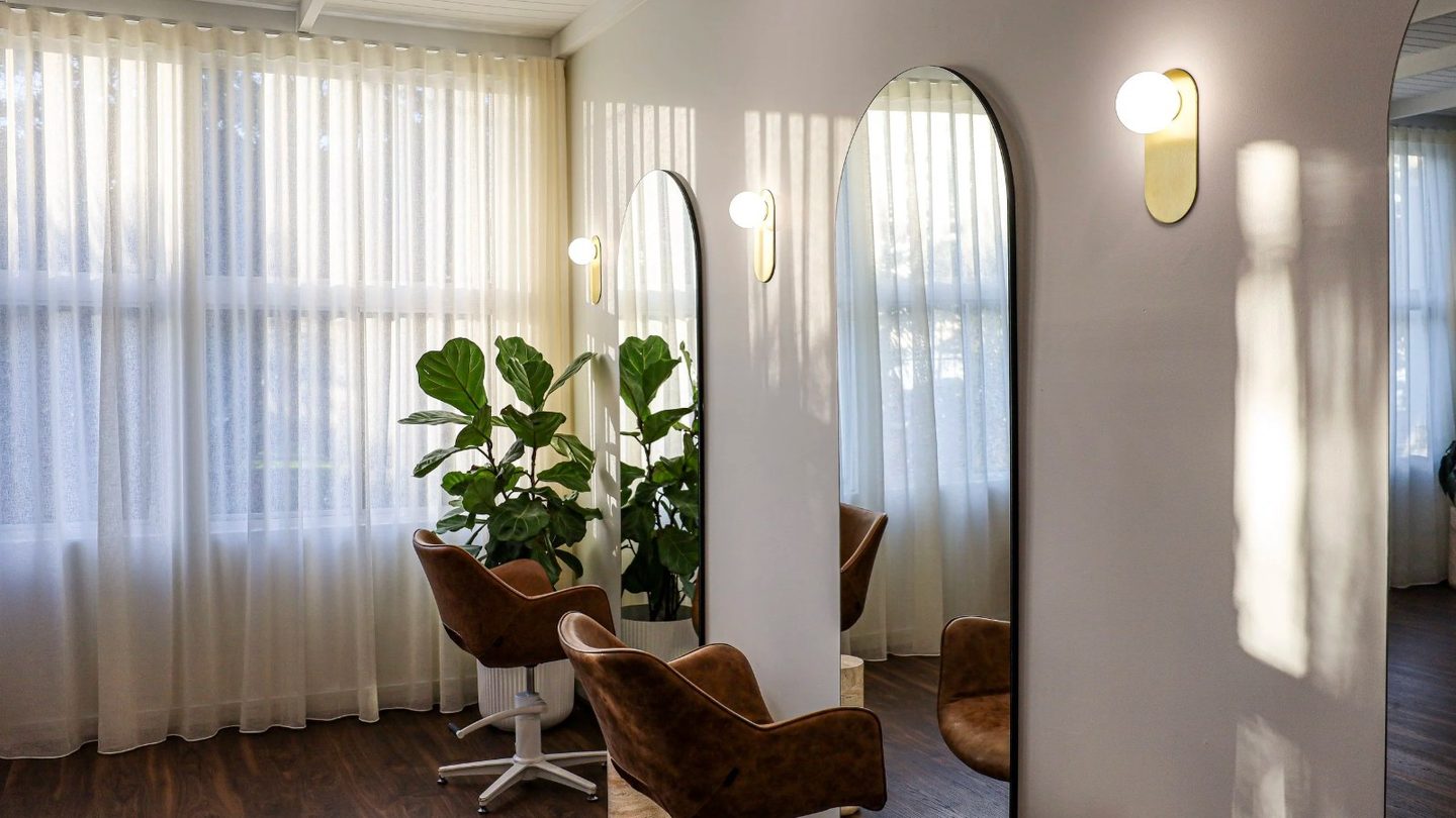 Arched mirrors and leather chairs at The Studio Upstairs
