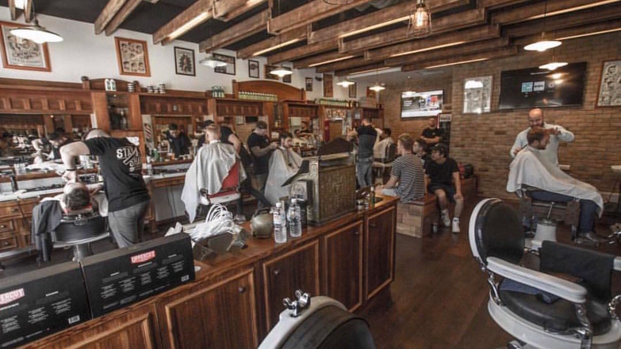 Barber chairs, timber fittings and customers at Barber Bros & Co.