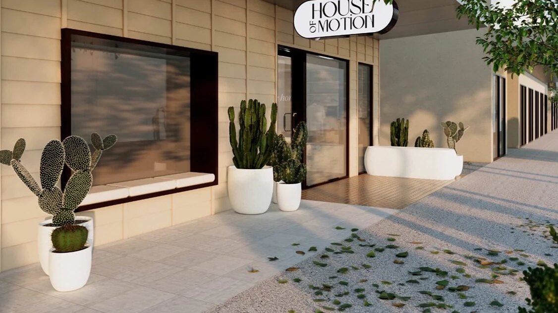 The House of Motion studio front, with potted cacti outside