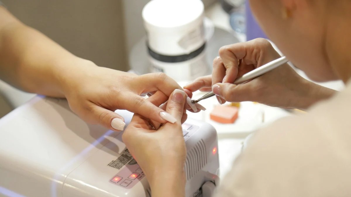 A manicure in progress at a nail salon