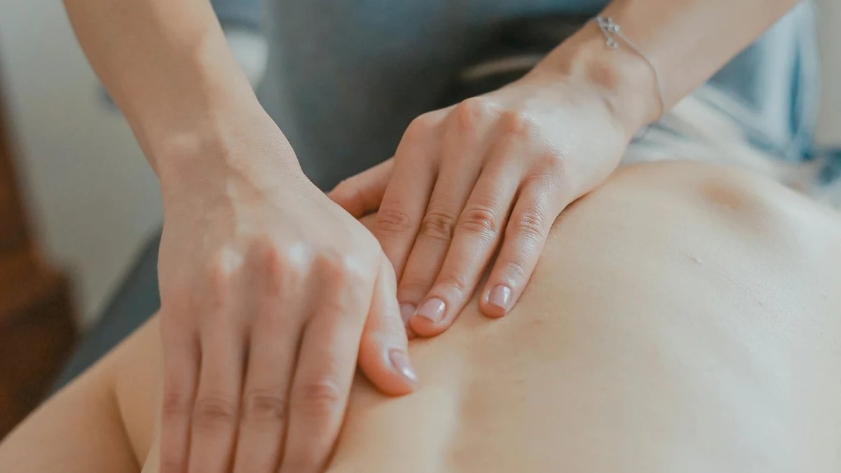 A massage therapist working on a client's back